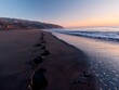 © MD - Footprints Leading to Ocean at Dawn