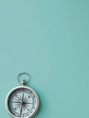 Leinwandbilder - A silver compass sits on a mint green background. The compass features clear lines and a simple design. Generative AI