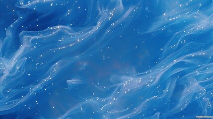   A zoomed-in view of a blue backdrop featuring water droplets and celestial objects at the base of the photograph