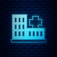 Poster - Glowing neon Medical hospital building with cross icon isolated on brick wall background. Medical center. Health care. Vector