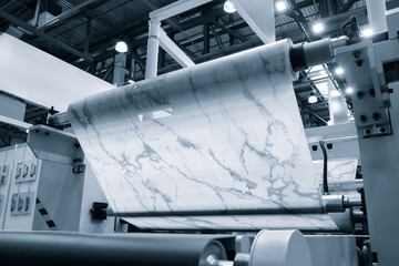 Leinwandbilder - At the factory, a roll of polyethylene plastic film with a marble pattern is cut. The concept is precision and efficiency as the machine carefully cuts the film specifications required for project.