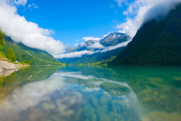 Wall Mural - beautiful mountain lake in norway. nature in fjords. high mountains and reflections on the surface o