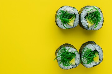Poster - Sushi and seaweed salad on yellow background