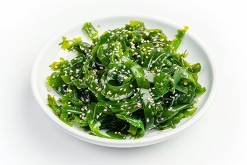 Wall Mural - Wakame seaweed on white plate against white background