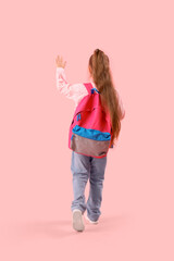 Sticker - Little schoolgirl with backpack waving hand on pink background, back view