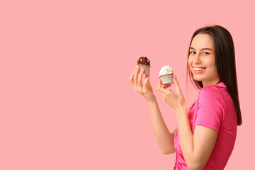 Poster - Young woman with sweet cupcakes on pink background. Valentine's Day celebration