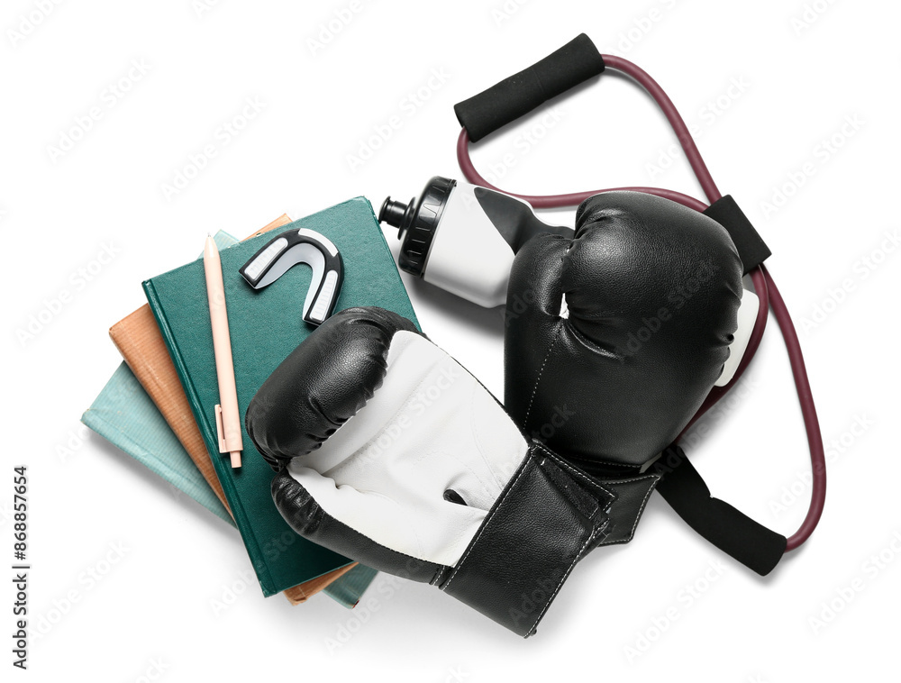 Composition with sports equipment and stationery on white background