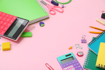 Wall Mural - School supplies with calculator, notebooks and erasers on pink background. Top view