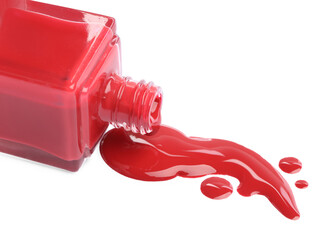 Wall Mural - Bottle and spilled red nail polish isolated on white