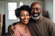 © Baba Images - Portrait of a middle aged couple in new home