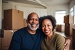 © Baba Images - Portrait of a middle aged couple in new home