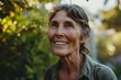 © Stocknterias - Portrait of a smiling senior woman standing in the garden on a sunny day