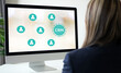 © mangpor2004 - Woman using computer with CRM, Customer Relationship Management, icon on screen background at office, success in business concept