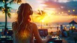 © Naknakhone - Young girl dj mixing outdoor during summer beach party at sunset time. copy space for text.
