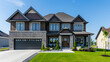 © Wira - Captivating exterior of a newly built luxury home, featuring a large brown house with a modern garage, located in a quiet and picturesque neighborhood in the suburbs of Canada.