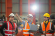 © eakgrungenerd - Metal steel sheets factory manager and employees inspecting products inside factory. Metalwork manufacturing Team professional walking training work for employees. Check quality of work with laptop.