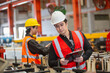 © eakgrungenerd - Team engineer workers working check up iron product manufacturing in metal steel sheets factory. Man manager of Metalwork Team professional work for Check quality of work writing on clipboard.