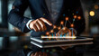 © Sami - Businessman using tablet analyzing sales data and economic growth graph chart, Technology and icon customer global network connection. Business strategy. Innovative. Digital market