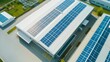 © CHOI POO - Drone view of solar panels on the roof of a large modern factory