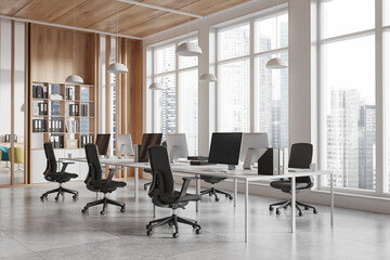 Wall Mural - Office interior with armchairs and desks, pc monitors and shelf near window