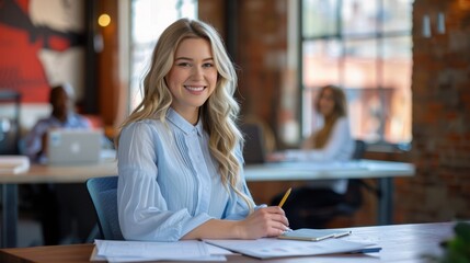 Wall Mural - The smiling businesswoman at desk