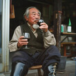 © lichaoshu - Japanese old man drinking wine at home