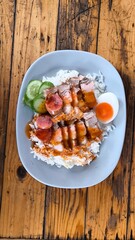 Canvas Print - Crispy pork rice on a blue plate on the dining table