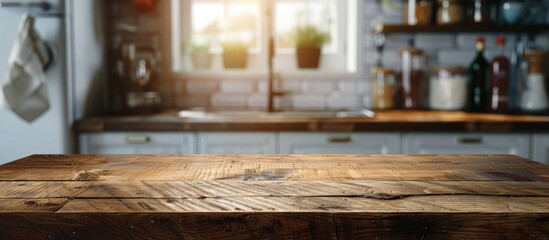 Wall Mural - Wooden table top on a blurred kitchen counter background for showcasing products or designing visual layouts.