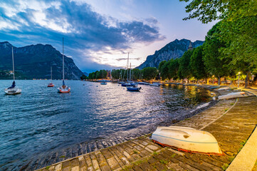 The lakefront of Lecco, photographed in the evening.