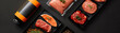© artitwpd - A variety of fresh, raw meats including beef, pork, and salmon. The meats are arranged on a black background with a sprinkle of spices and herbs, and a blank orange label.