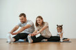 © standret - Family of mother, father and daughter are doing yoga at home