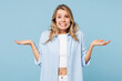 © ViDi Studio - Young sad doubtful woman wears white top shirt casual clothes shrugging shoulders looking puzzled, have no idea isolated on plain pastel light blue cyan background studio portrait. Lifestyle concept.