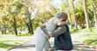 © peopleimages.com - Happy and mature couple hugging outdoor at park for commitment, relationship and wellness. Smile, black man and woman with love embrace in nature for empathy, support and dedication to marriage