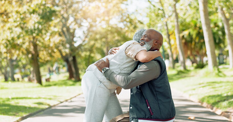 Wall Mural - Happy and mature couple hugging outdoor at park for commitment, relationship and wellness. Smile, black man and woman with love embrace in nature for empathy, support and dedication to marriage