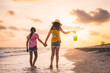 © Matt - sunset stroll down Sanibel Island beaches with their shell bucket and a golden hour beach walk