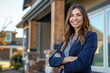 © steevy84 - Confident real estate agent, beautiful woman stands proudly outside a modern home.