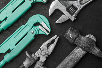 Steel tools on black background. Construction and repair tools