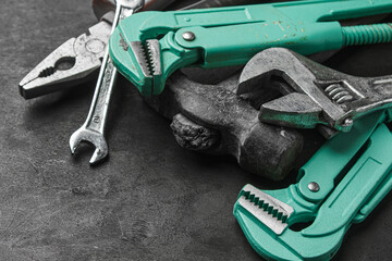 Steel tools on black background. Construction and repair tools