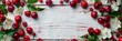 © Wolfilser - many red and healthy cherry fruits on background with old textured wooden boards