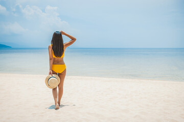 Traveler asian woman relax and travel on beach at day in Koh Rap Samui Thailand summer season