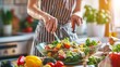 © Elkhan Babayev - Image of a woman preparing a healthy salad in the kitchen, showcasing home cooking, healthy eating habits, wellness nutrition, weight loss recipes, and daily life routines.