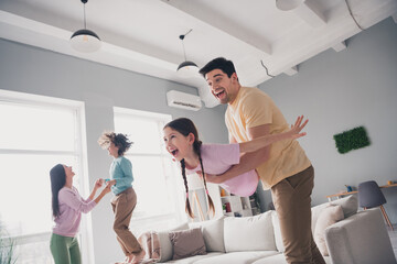 Canvas Print - Photo of adorable charming mom dad children wear casual outfits fooling together indoors room home house