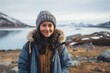 © Markus Schröder - Portrait of a glad woman in her 30s sporting a rugged denim jacket over backdrop of an arctic landscape