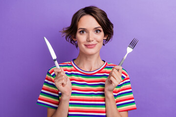 Wall Mural - Photo of lovely cute girl wear trendy clothes showing cutlery waiting dinner lunch dish isolated on purple color background