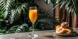 © Phonlasit - orange juice with peach puree in flute glass, on bar background.