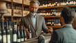 © mikhailberkut - Sophisticated Sommelier Presenting Fine Wine to Customer in Upscale Wine Shop