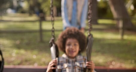 Wall Mural - Mother, child and playing with swing at park for fun ride, bonding or outdoor holiday weekend in nature. Happy little boy, child or kid with parent in joy, happiness or cheerful playground in woods