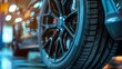 © Prostock-studio - Close-up of black car wheel and tire displaying detailed alloy design and deep tread pattern. Emphasizes the importance of quality tires for top performance.