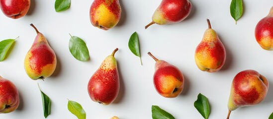 Poster - Ripe red and yellow pears with leaves isolated on a white background, providing copy space in a top-view flat lay pattern.