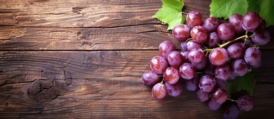 Poster - Grape on a wooden table with copy space image.